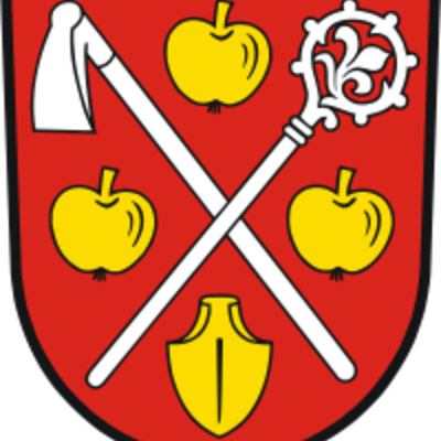 In Rot schräggekreuzt eine silberne Hacke und ein silberner Krummstab, begleitet: oben und auf beiden Seiten von einem goldenen Apfel, unten von einer goldenen Pflugschar.